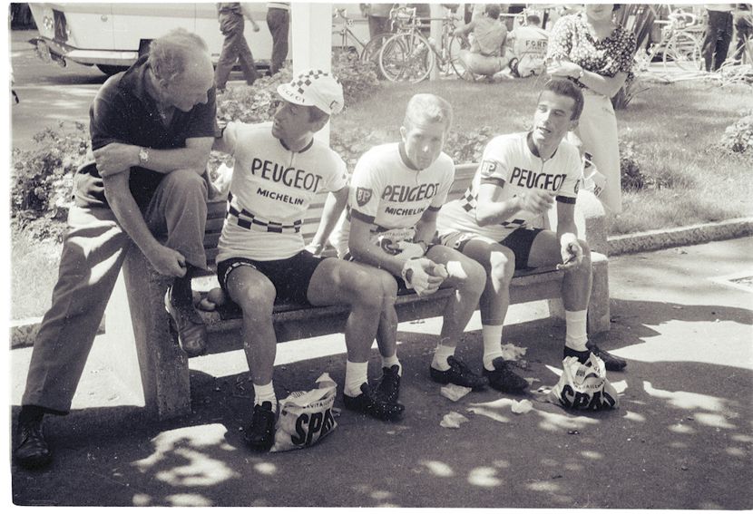 Image of Three men on a bench